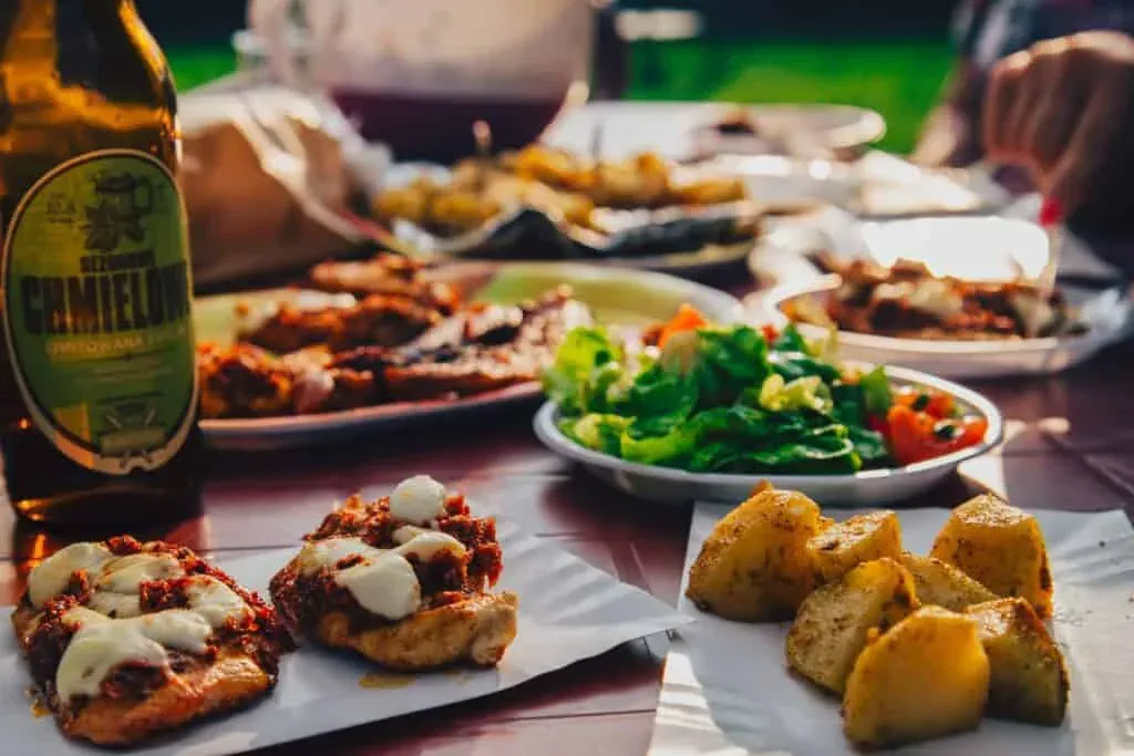 Guests sharing coffee and food at a busy cafe table