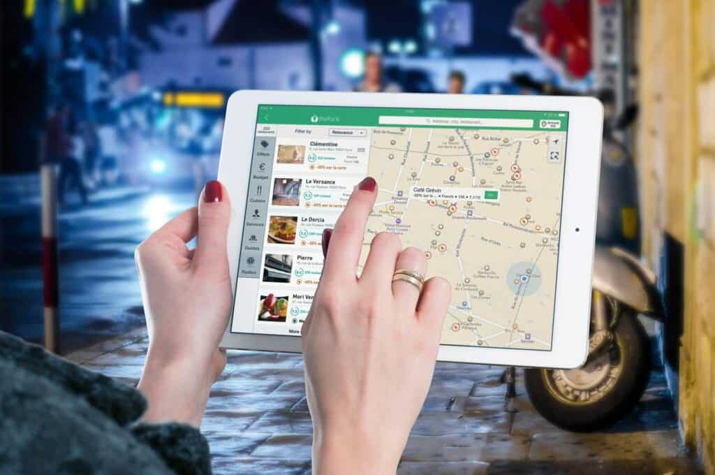 tablet with maps showing restaurants in the area