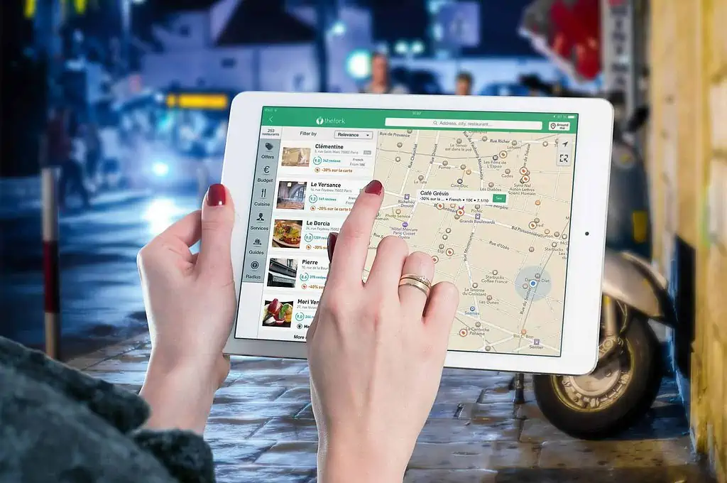 tablet with maps showing restaurants in the area